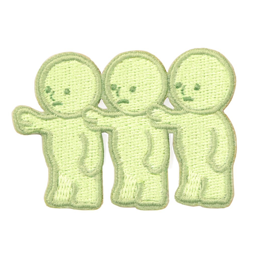 Little sticker variant- three SMISKI face left with their hands on each others right shoulder. Left most SMISKI is reaching out with its hand