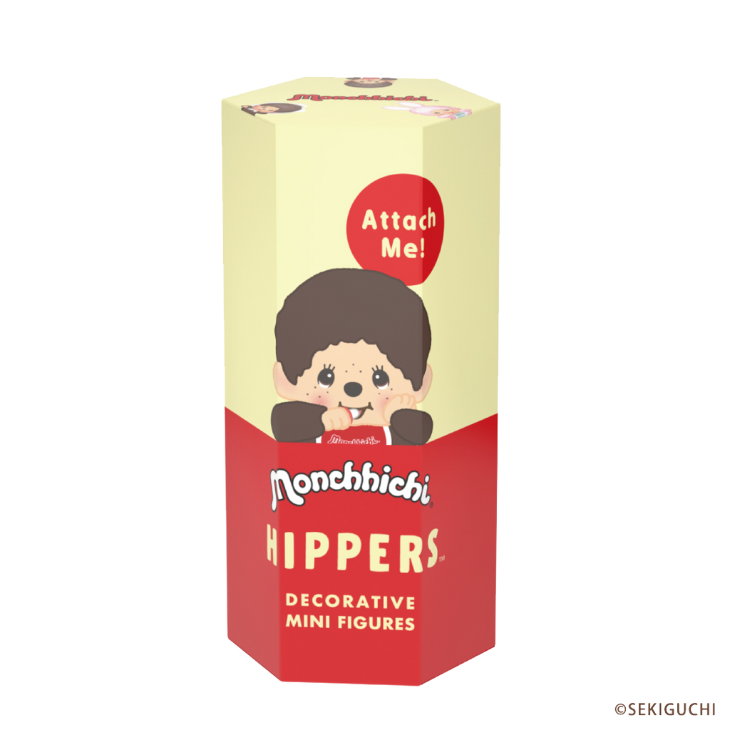 Monchhichi product packaging shows a yellow and red box depicting a Monchhichi HIPPER with text that includes "Attach me!" as well as "decorative mini figures" 