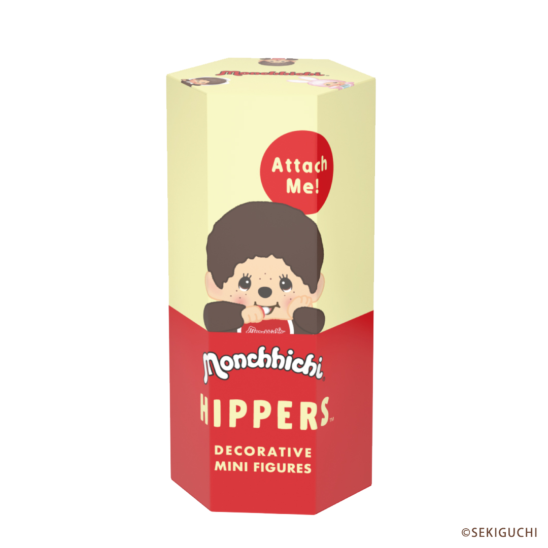 Monchhichi product packaging shows a yellow and red box depicting a Monchhichi HIPPER with text that includes "Attach me!" as well as "decorative mini figures" 