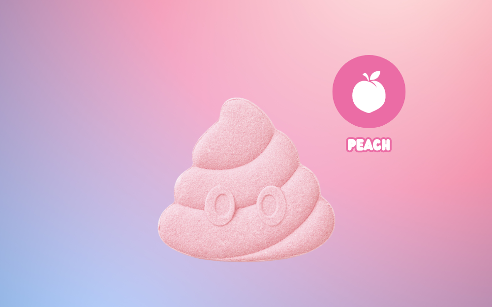 product closeup of poop emoji rainbomb mini pink against a pink and purple background with the text PEACH