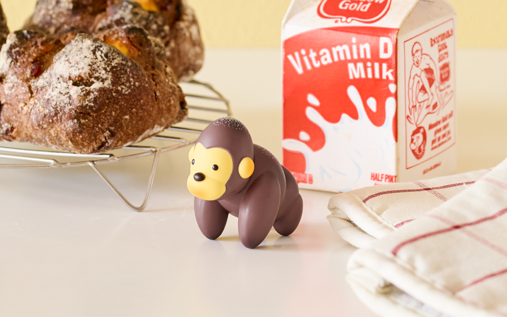 gorilla figurine with a box of Vitamin D Milk and bread in the background.