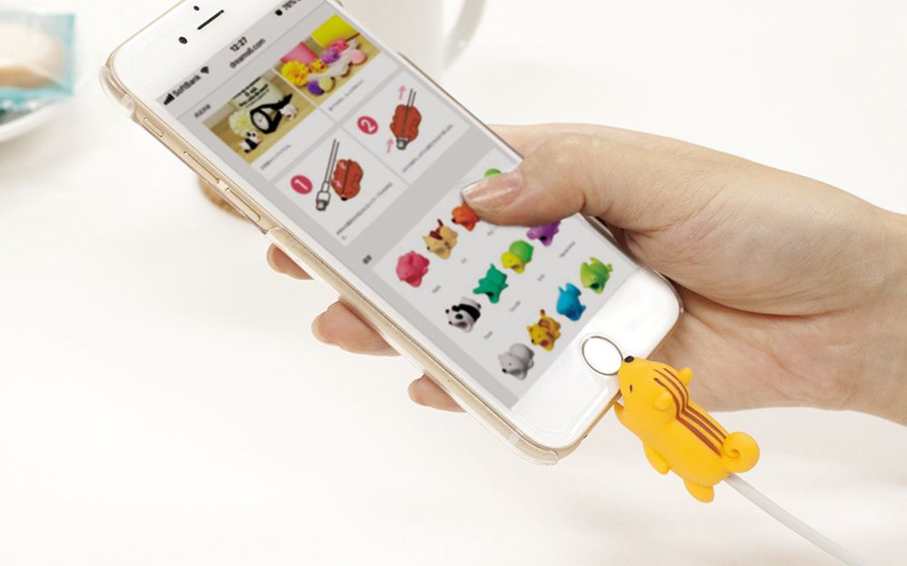 Product image shows Cable Bite Vol. 1 on a white charging cable, plugged into an iPhone being held by a hand against a white background