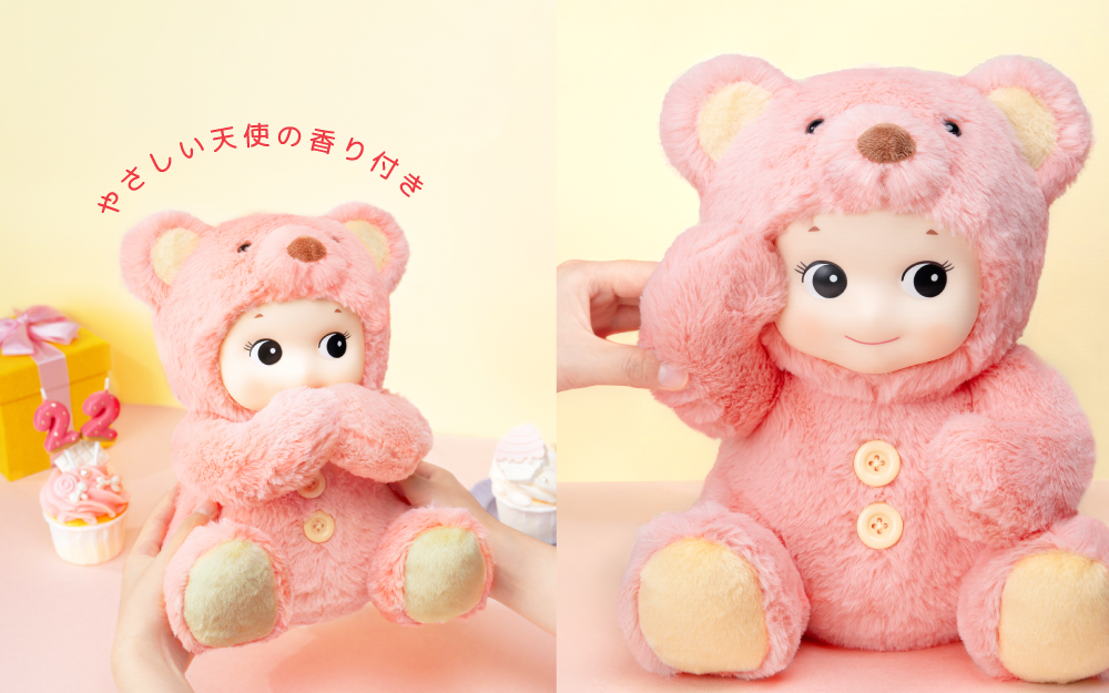Two pink teddy bears with angelic features on a light yellow background