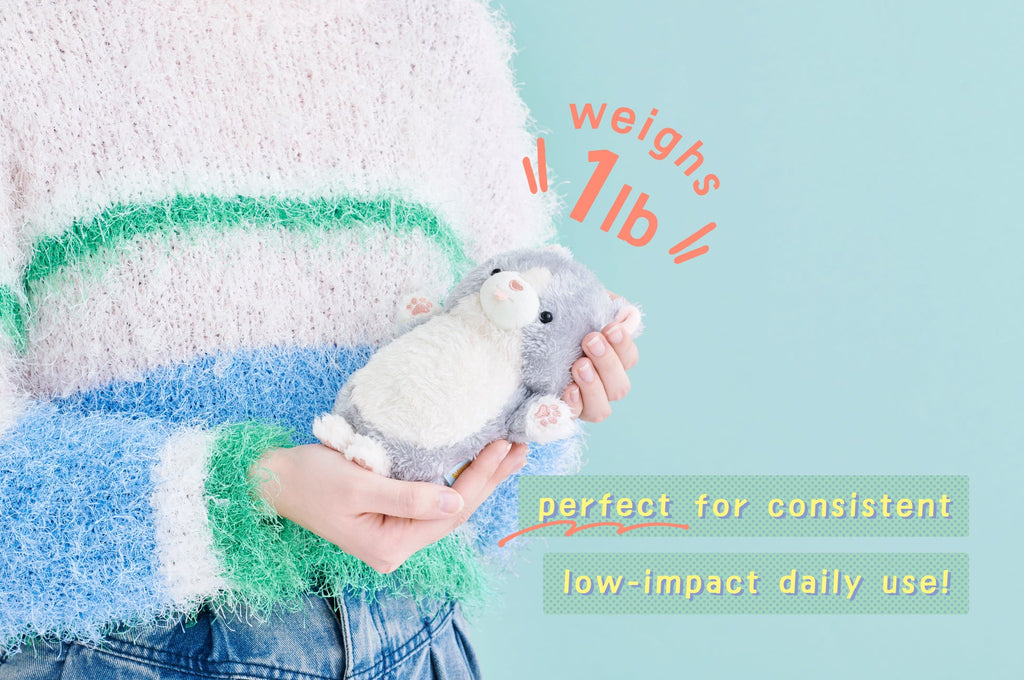 mugyuuus product banner image featuring person in a blue, green, and white sweater holding peanuts the cat mugyuuus plush. text reads WEIGHS 1lb - perfect for consistent low-impact daily use!