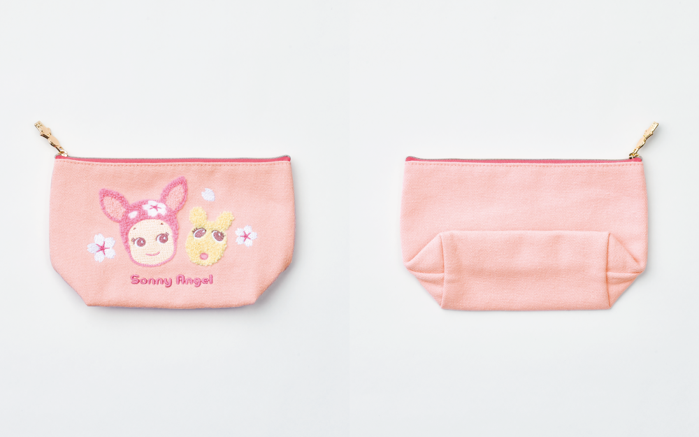 product closeup of sonny angel cherry blossom zipper pouch. left showcases front of pouch (pink with sewn sonny angel and robby faces) and right shows back (plain pink)