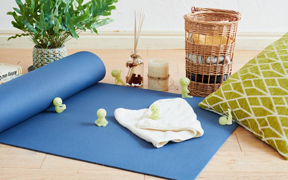 smiski yoga series lineup with series on a yoga themed background