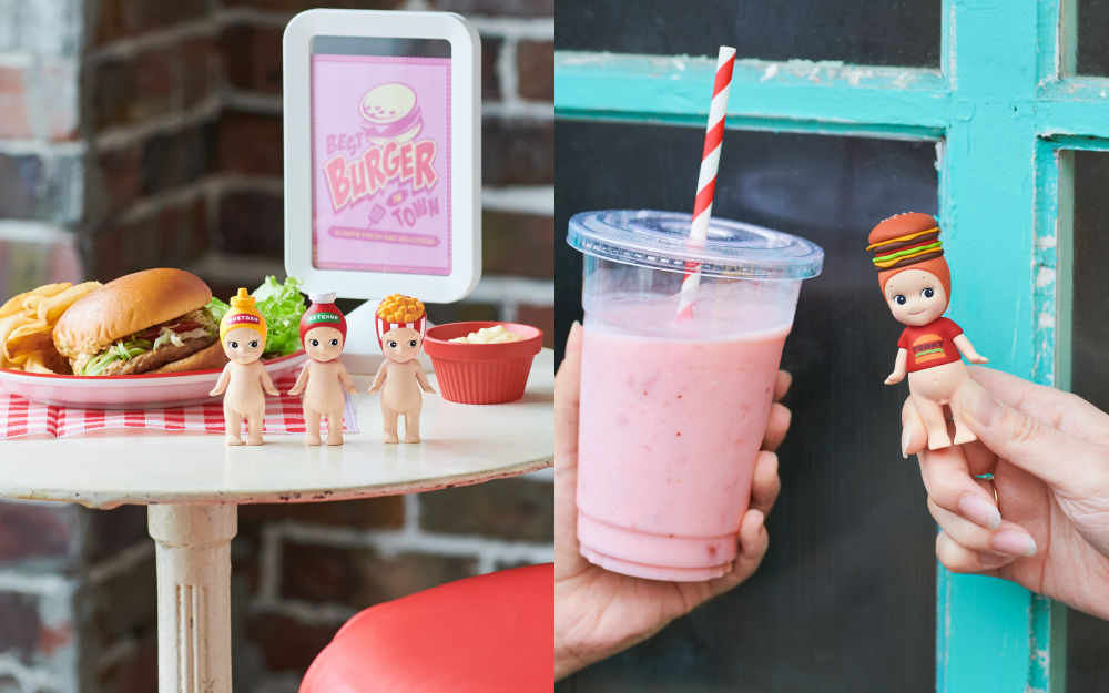 sonny angel snack series banner image featuring two lifestyle images spliced together. left: sonny angel minifigures mustard, ketchup, and french fries sitting on a white metal table in front of a brick background. table also has food props, including a plated hamburger and fries, mayo cup, and pink sign reading BEST BURGER IN TOWN. right: two hands holding a pink milkshake and the double decker sonny angel snack series secret figure against a blue windowframe background