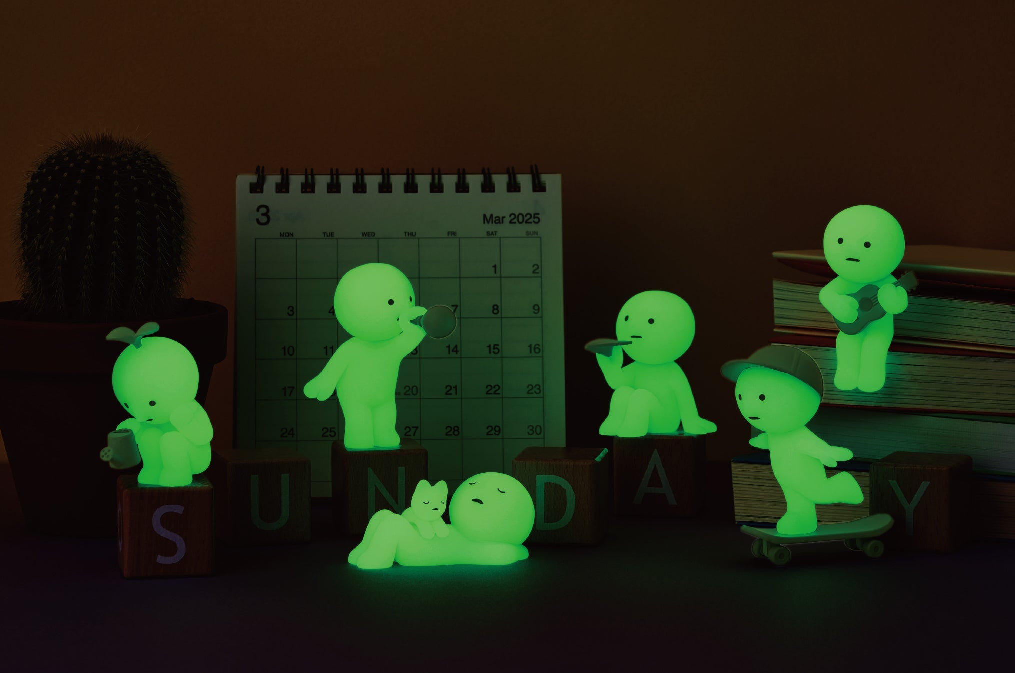 lifestyle image of the main lineup for the smiski sunday series glowing in a dark room. from left to right: gardening, blowing bubbles, sunbathing, paper airplane, skateboarding, and sing-along.
