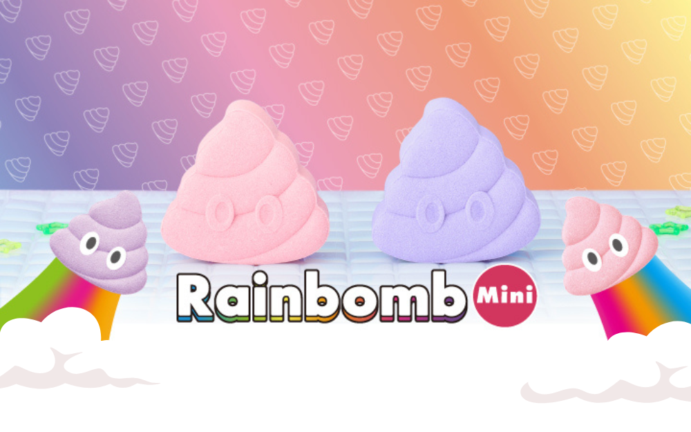 bath bombs designed to look like poop emojis in pink and purple colors, with a rainbow trail in the background and the text RAINBOMB MINI