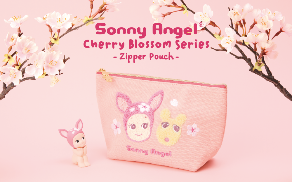 A pink zipper pouch with cherry blossom patterns and cartoon characters, including a Sonny Angel minifigure.