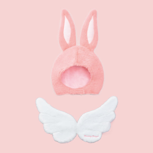 closeup product image of the sonny angel costume series 2 refined rabbit costume headdress from the front and wings from the back on a pink background. 