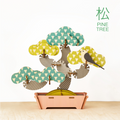 assembled pine tree bonsai puzzle against a white background with text PINE TREE in top righthand corner