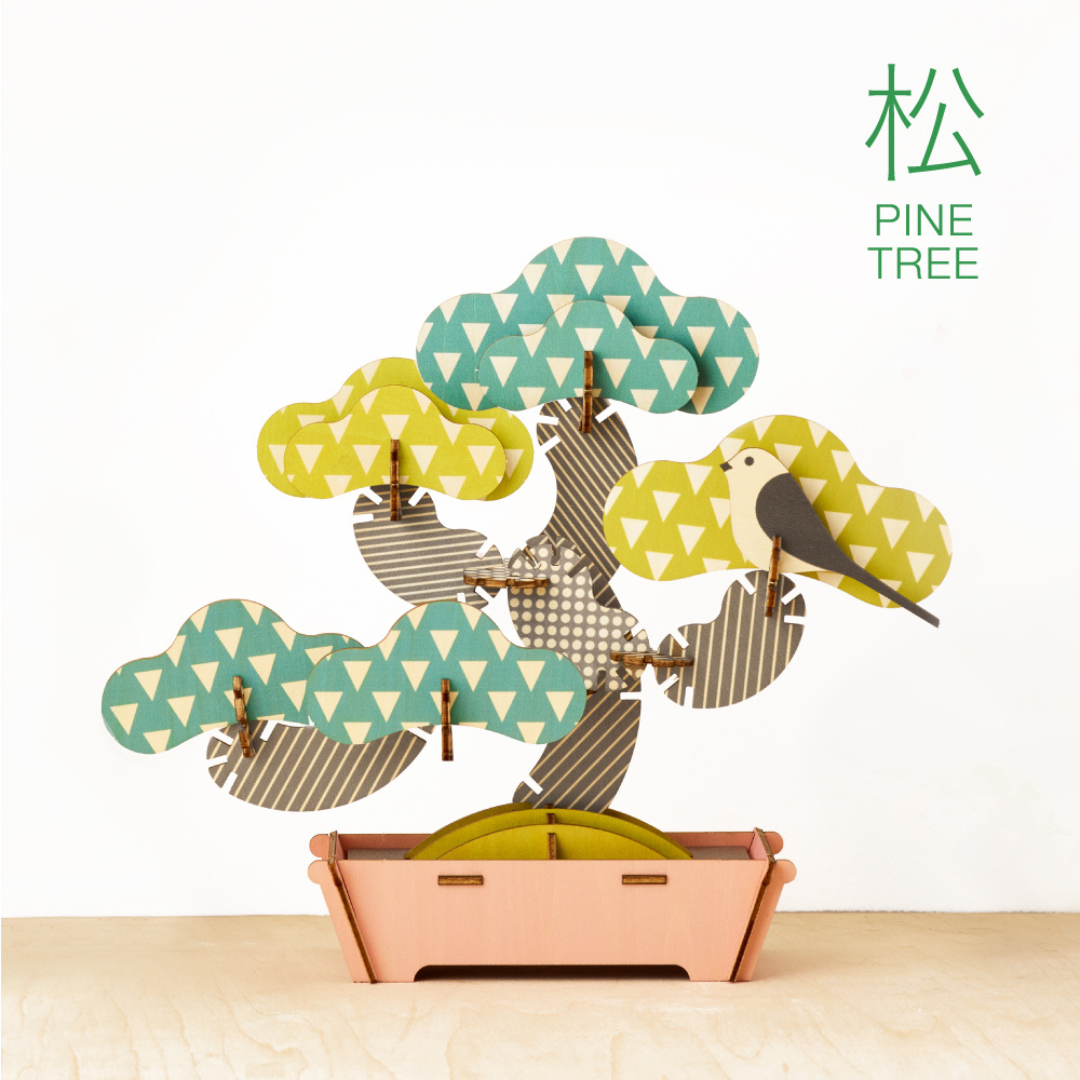 assembled pine tree bonsai puzzle against a white background with text PINE TREE in top righthand corner